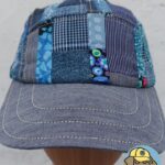 front view of a blue patchwork 5 panel hat