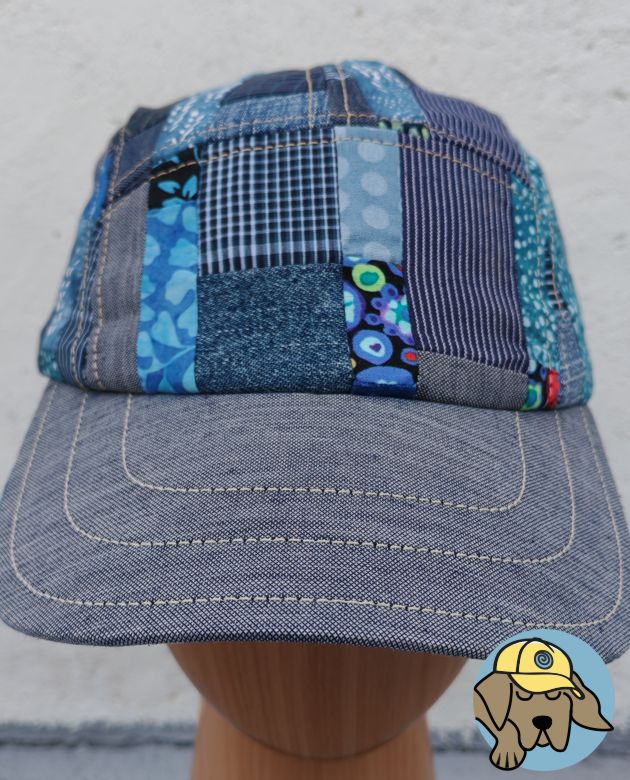 front view of a blue patchwork 5 panel hat