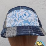 front view of blue 5 panel cap showing batik roses