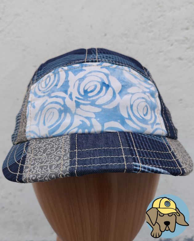 front view of blue 5 panel cap showing batik roses